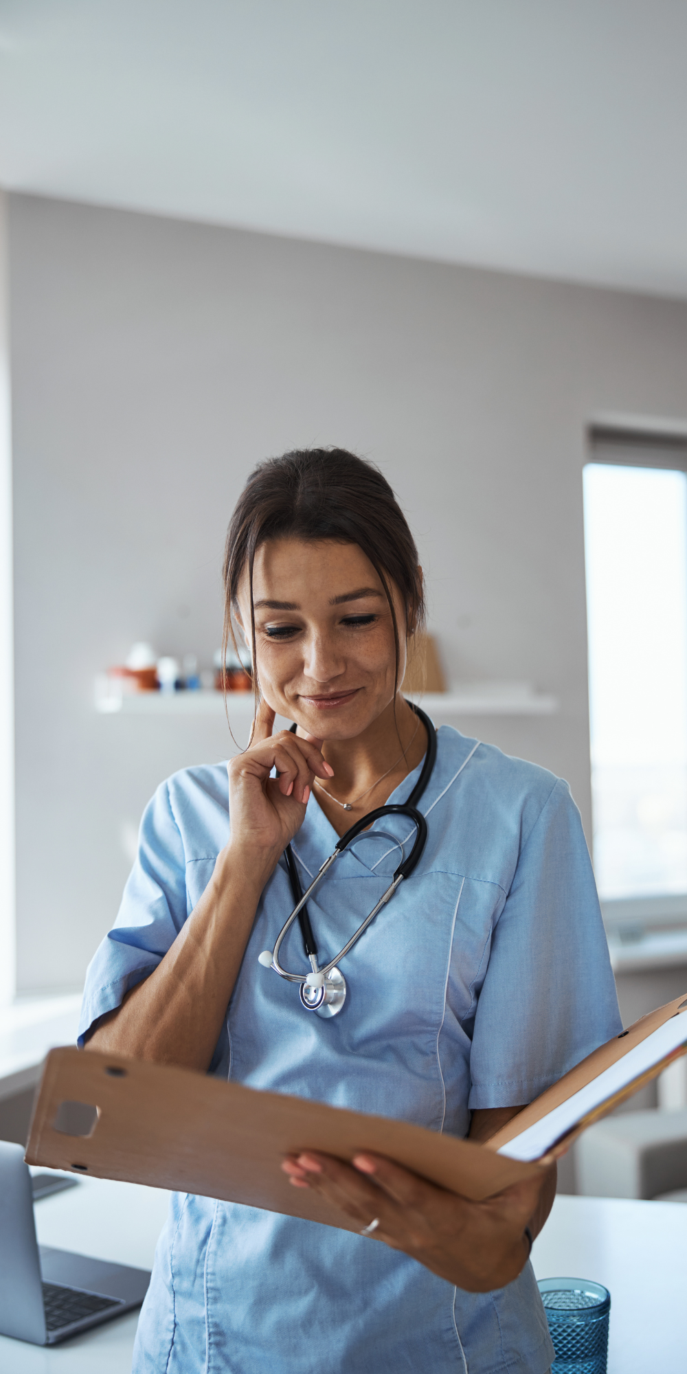 Doctor looking at folder