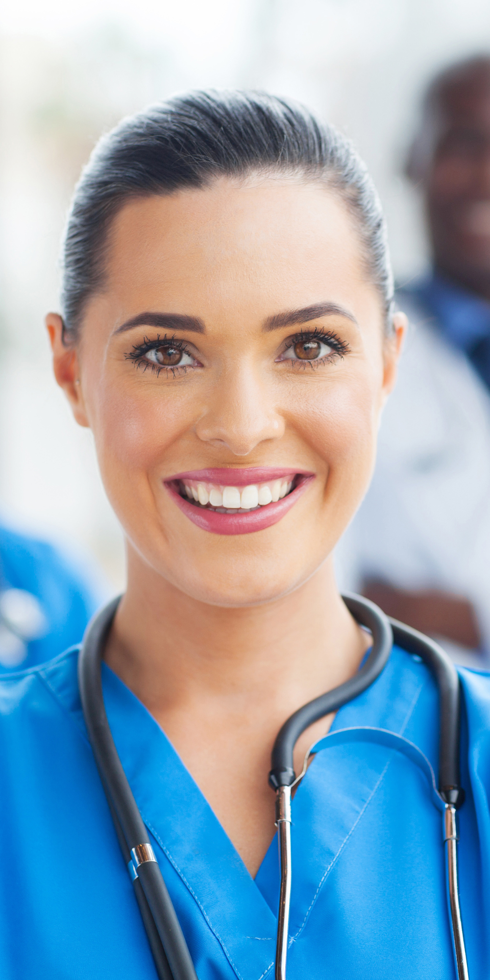 Woman Smiling with Stethoscope