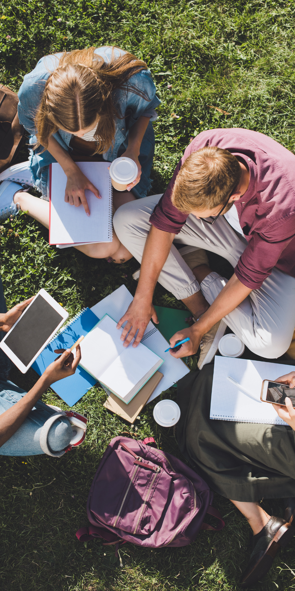 Students doing homework outside