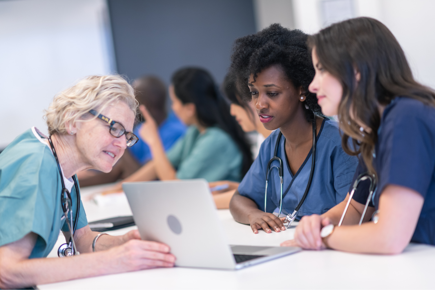 Teacher helps two medical students