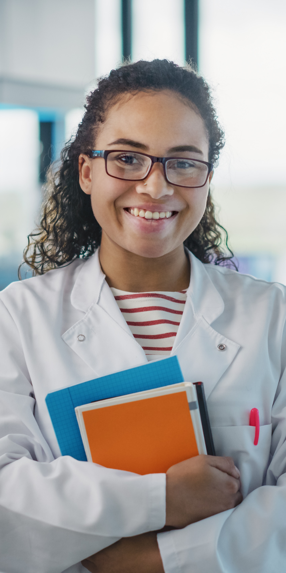 Woman Holding Notebooks